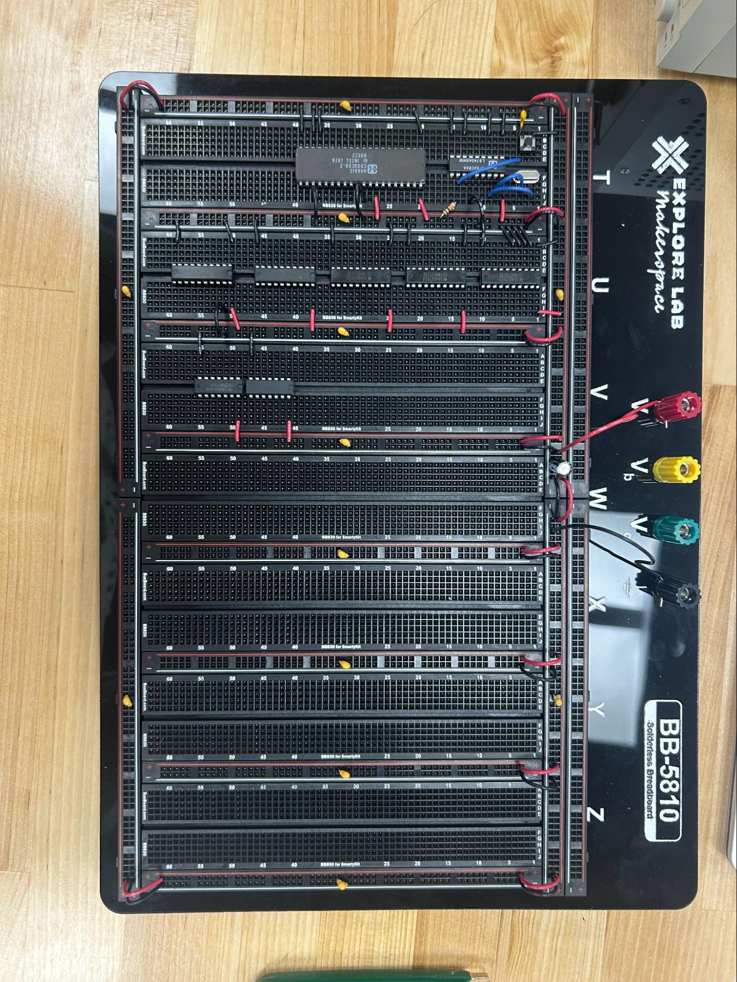 Breadboard with power rails connected and capacitors placed